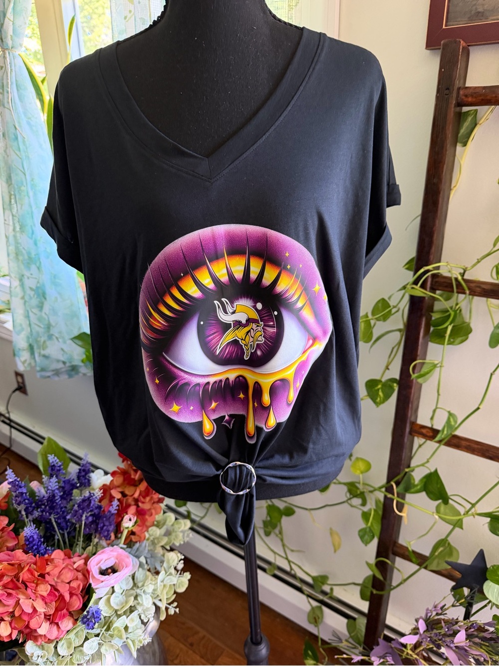 Minnesota Vikings Black Tee with Purple & Yellow Dripping Eye Graphic